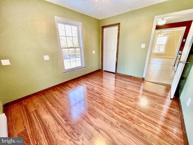 unfurnished bedroom featuring light wood-type flooring