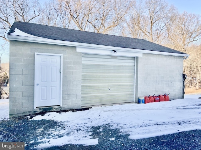 view of snow covered garage