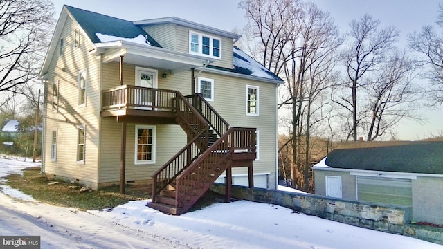 view of snow covered house