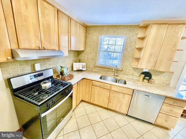 kitchen with light tile patterned flooring, sink, light brown cabinets, appliances with stainless steel finishes, and backsplash