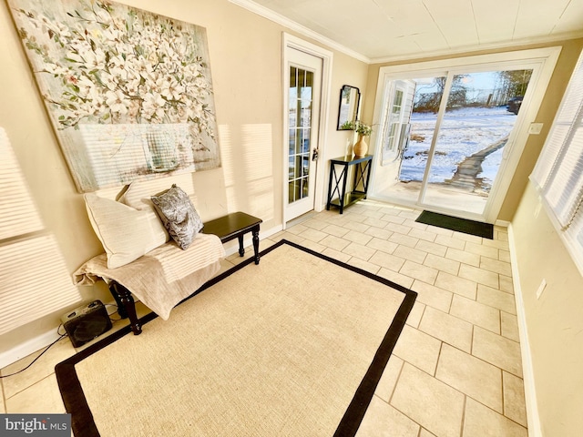 sitting room featuring tile patterned flooring and crown molding