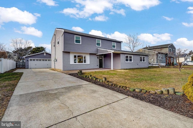 front of property featuring a garage, an outdoor structure, and a front lawn