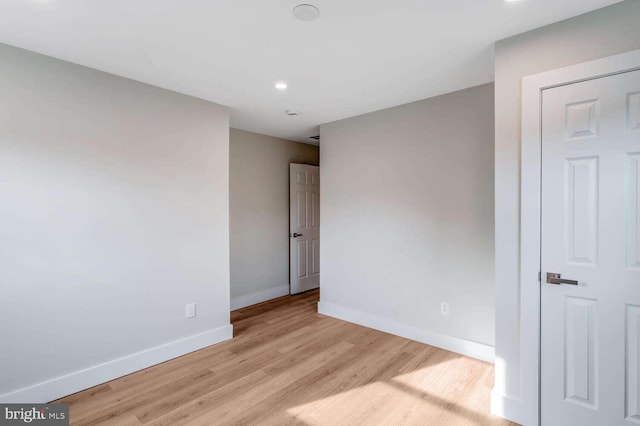 unfurnished bedroom with light wood-type flooring