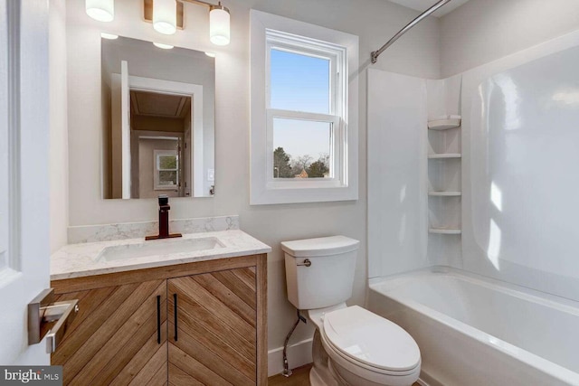 full bathroom featuring shower / tub combination, vanity, and toilet