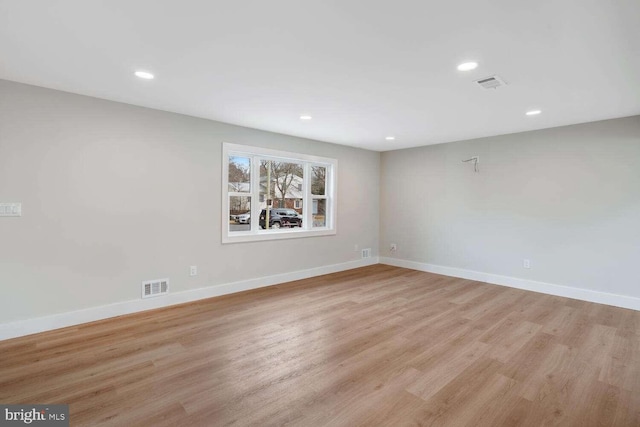 unfurnished room featuring light wood-type flooring