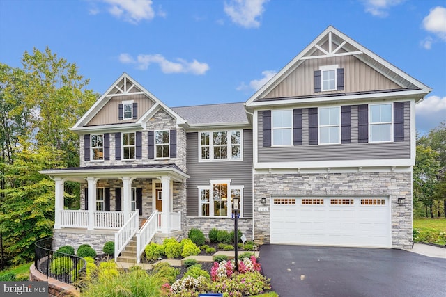 craftsman inspired home featuring a porch and a garage