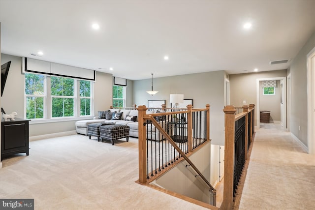 interior space featuring light colored carpet