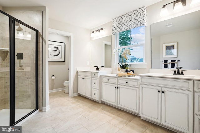 bathroom featuring walk in shower, vanity, and toilet