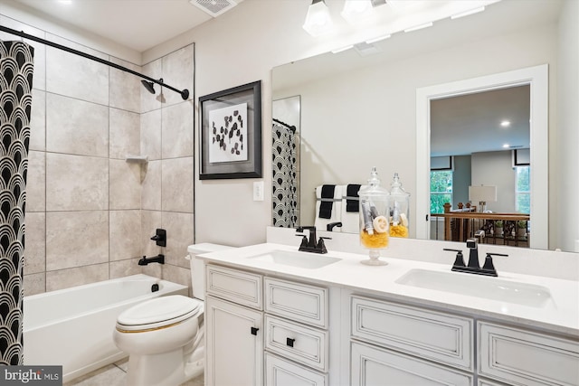 full bathroom featuring vanity, toilet, and shower / bath combo