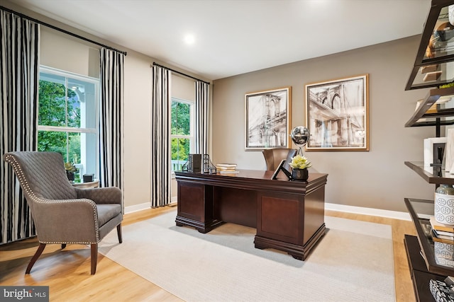 office space with light wood-type flooring