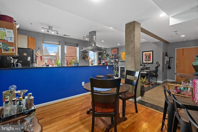 dining room with light hardwood / wood-style floors