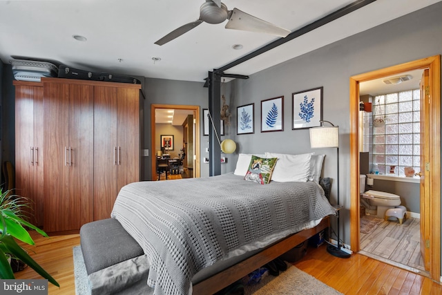 bedroom with ceiling fan, ensuite bathroom, and light hardwood / wood-style floors