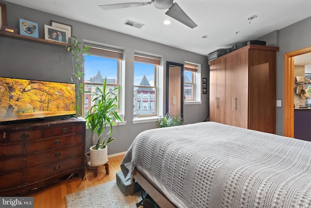 bedroom featuring ceiling fan and light wood-type flooring