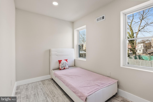 bedroom with light hardwood / wood-style floors