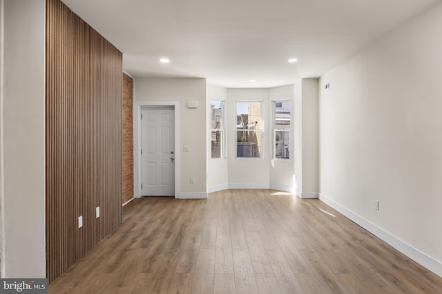 unfurnished room with light hardwood / wood-style flooring