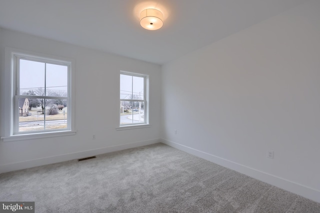 unfurnished room with carpet