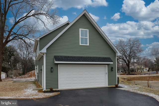 view of side of property featuring a garage