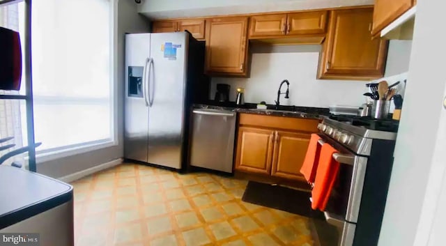 kitchen featuring stainless steel appliances and sink