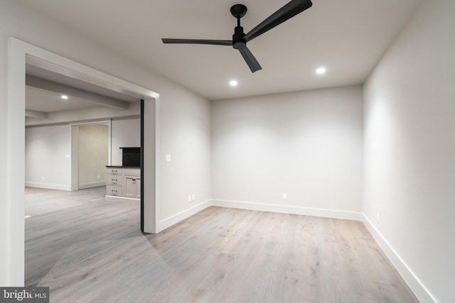 unfurnished room featuring ceiling fan and light hardwood / wood-style flooring