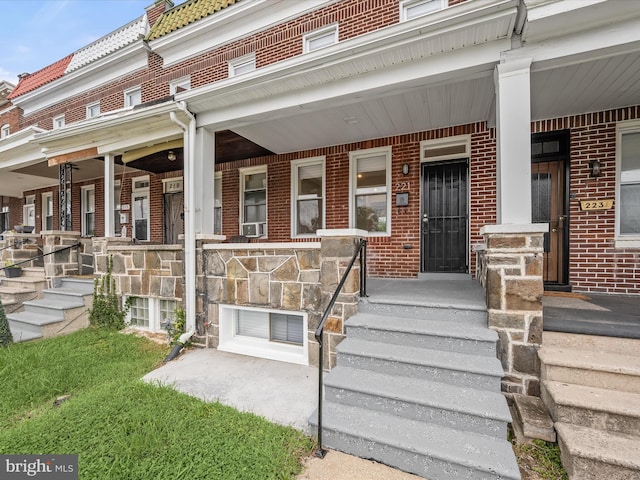 doorway to property featuring covered porch