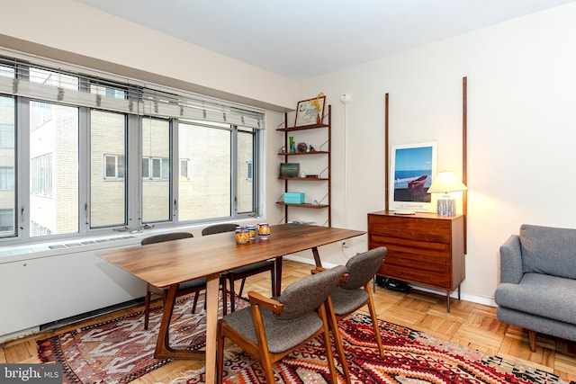 dining area with light parquet floors