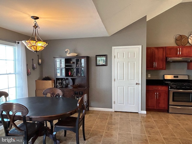 dining space with vaulted ceiling