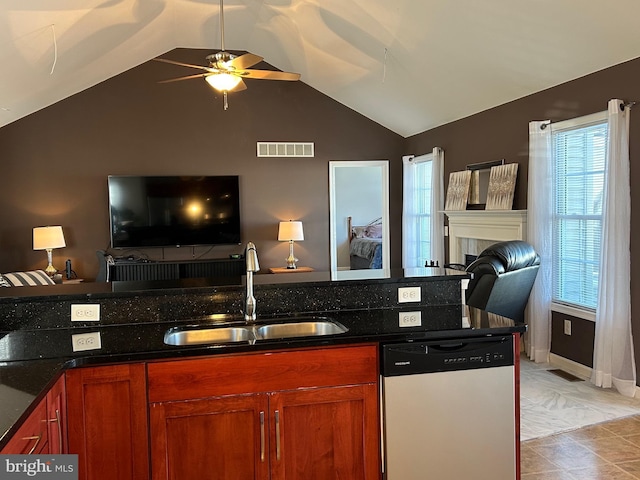 kitchen featuring a wealth of natural light, sink, and stainless steel dishwasher