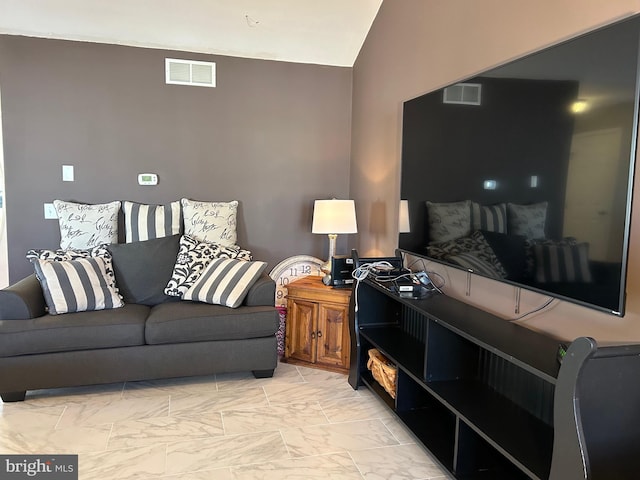 living room with vaulted ceiling