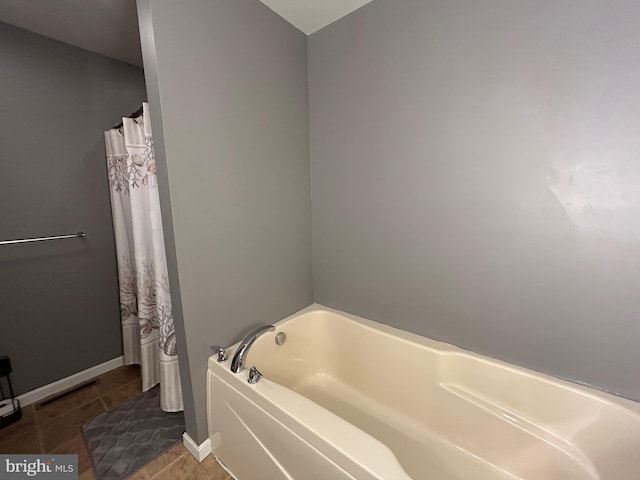 bathroom featuring a washtub