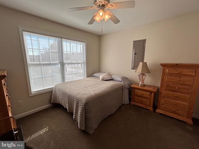 carpeted bedroom with ceiling fan and electric panel