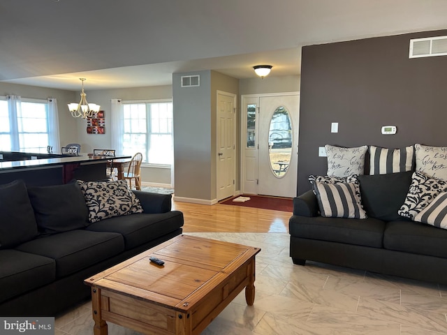 living room featuring an inviting chandelier