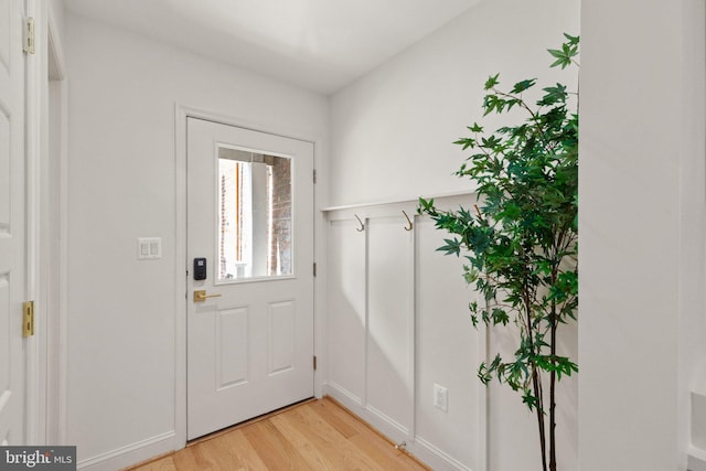 entryway with light hardwood / wood-style flooring