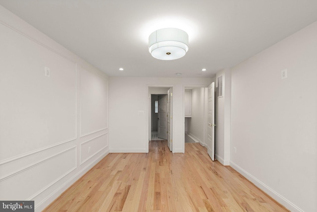 spare room with light wood-type flooring