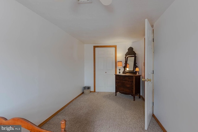 bedroom featuring carpet and baseboards