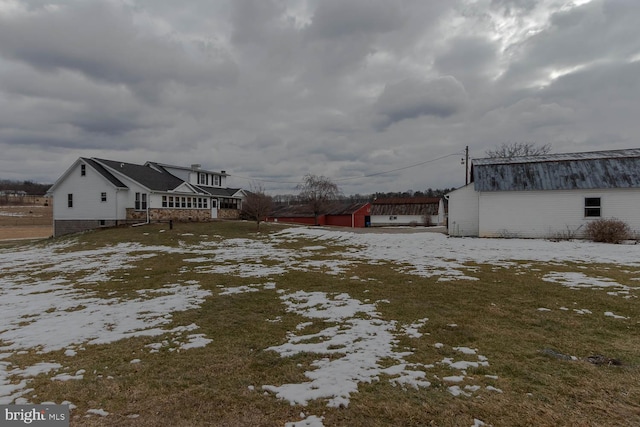 view of yard covered in snow