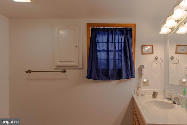 bathroom featuring vanity and an inviting chandelier