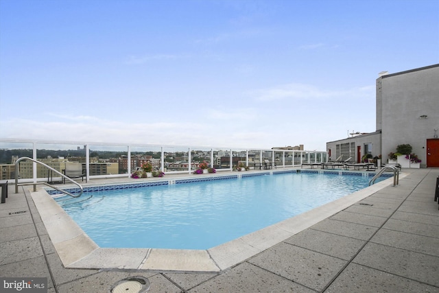 view of pool featuring a patio area