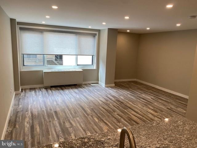 spare room featuring hardwood / wood-style flooring