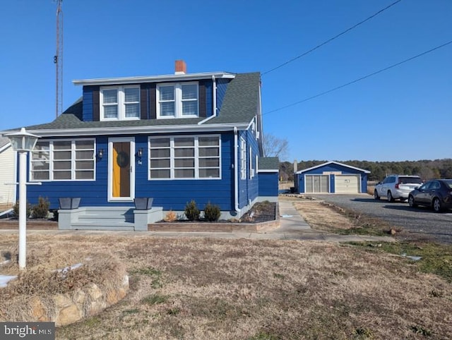 view of front of home featuring an outbuilding and a garage