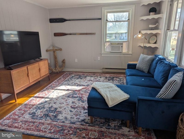 living room featuring a baseboard radiator, dark wood-type flooring, and cooling unit