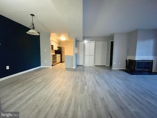 unfurnished living room with light hardwood / wood-style floors