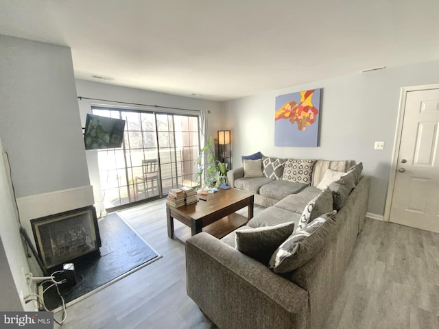 living room with light hardwood / wood-style floors