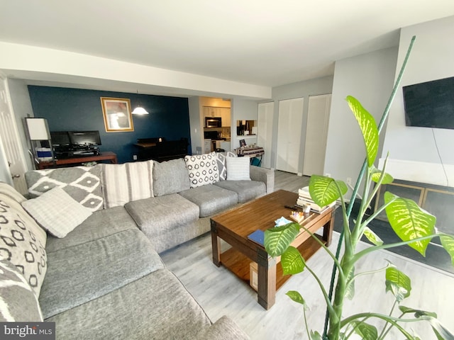 living room with light hardwood / wood-style floors