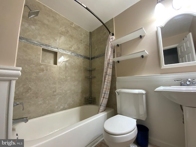 full bathroom featuring sink, toilet, and shower / bath combo