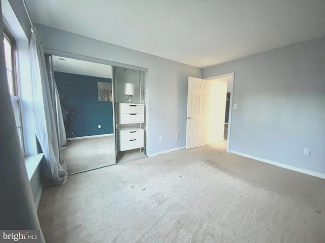 unfurnished bedroom featuring carpet flooring