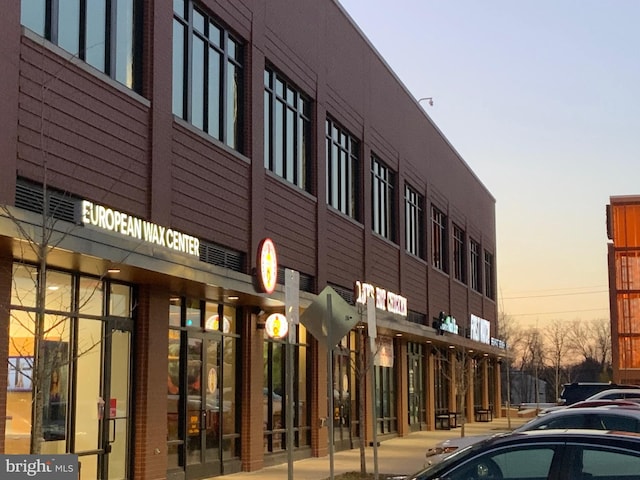 view of outdoor building at dusk