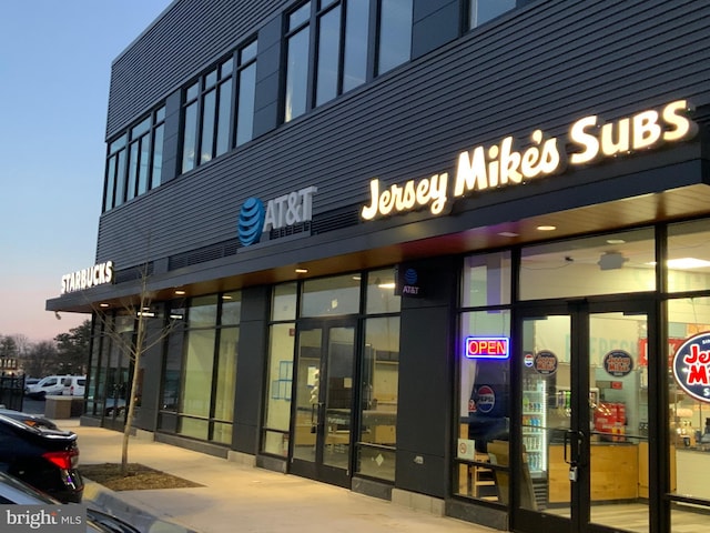 view of outdoor building at dusk