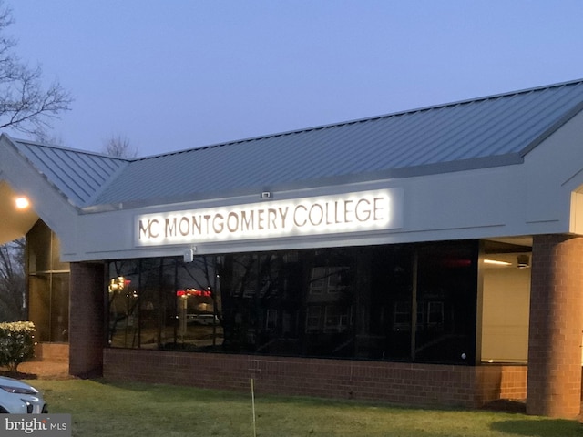 view of outdoor building at dusk