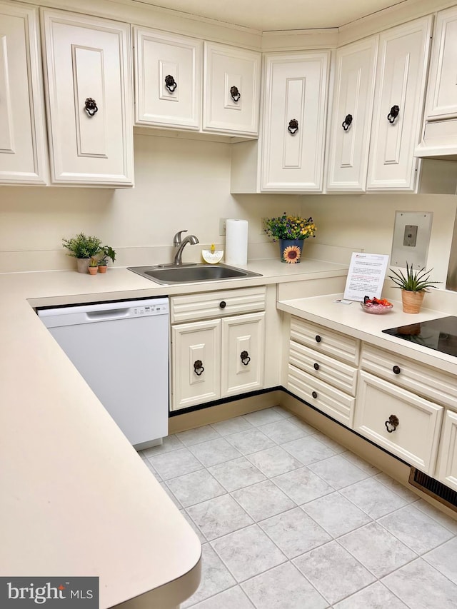 kitchen with white cabinets, light countertops, and dishwasher