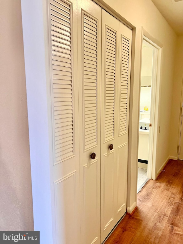 interior details featuring baseboards and wood finished floors